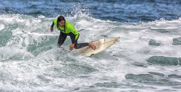Surfer in action on wave