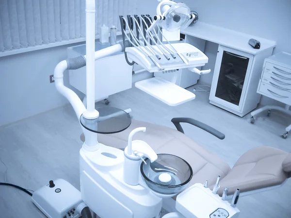 Dental chair and dental instruments in the dentist\'s office