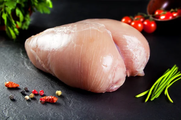 Raw and fresh meat. Whole chicken breast uncooked and uncut