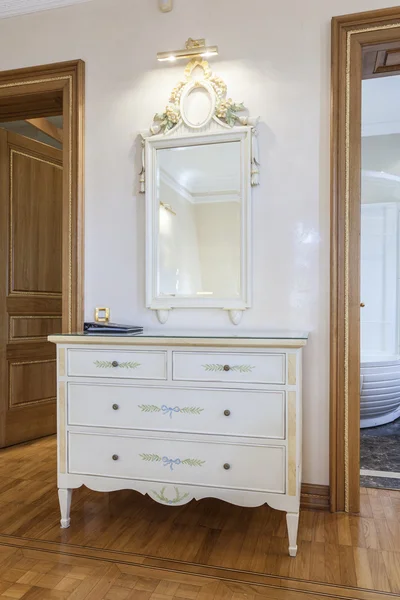 Antique mirror and cabinet in classic style room
