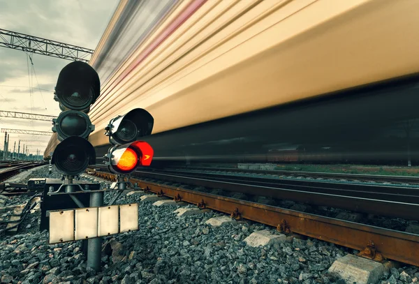 High speed passenger train on tracks with motion blur effect at